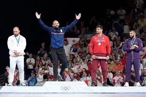 | Photo: AP/Eugene Hoshiko : Paris Olympics men's freestyle 125kg wrestling: Iran's Amir Hossein Zare, silver, Georgia's Geno Petriashvili, gold, Turkey's Taha Akgul, Azerbaijan's Giorgi Meshvildishvili, bronze